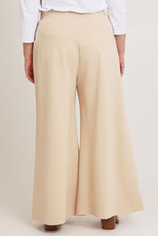Model Chanel wearing size 16 of the Meet Me At Midnight Wide Leg Ponte Pants in colour Sand, from the back