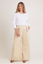 Model Chanel wearing size 16 of the Meet Me At Midnight Wide Leg Ponte Pants in colour Sand, from the front, showing the whole outfit