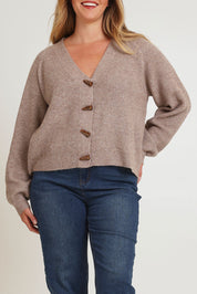 Model Chanel wearing size XL of the Found My Friend Recycled Knit Cardi in colour Earth, from the front, cropped image