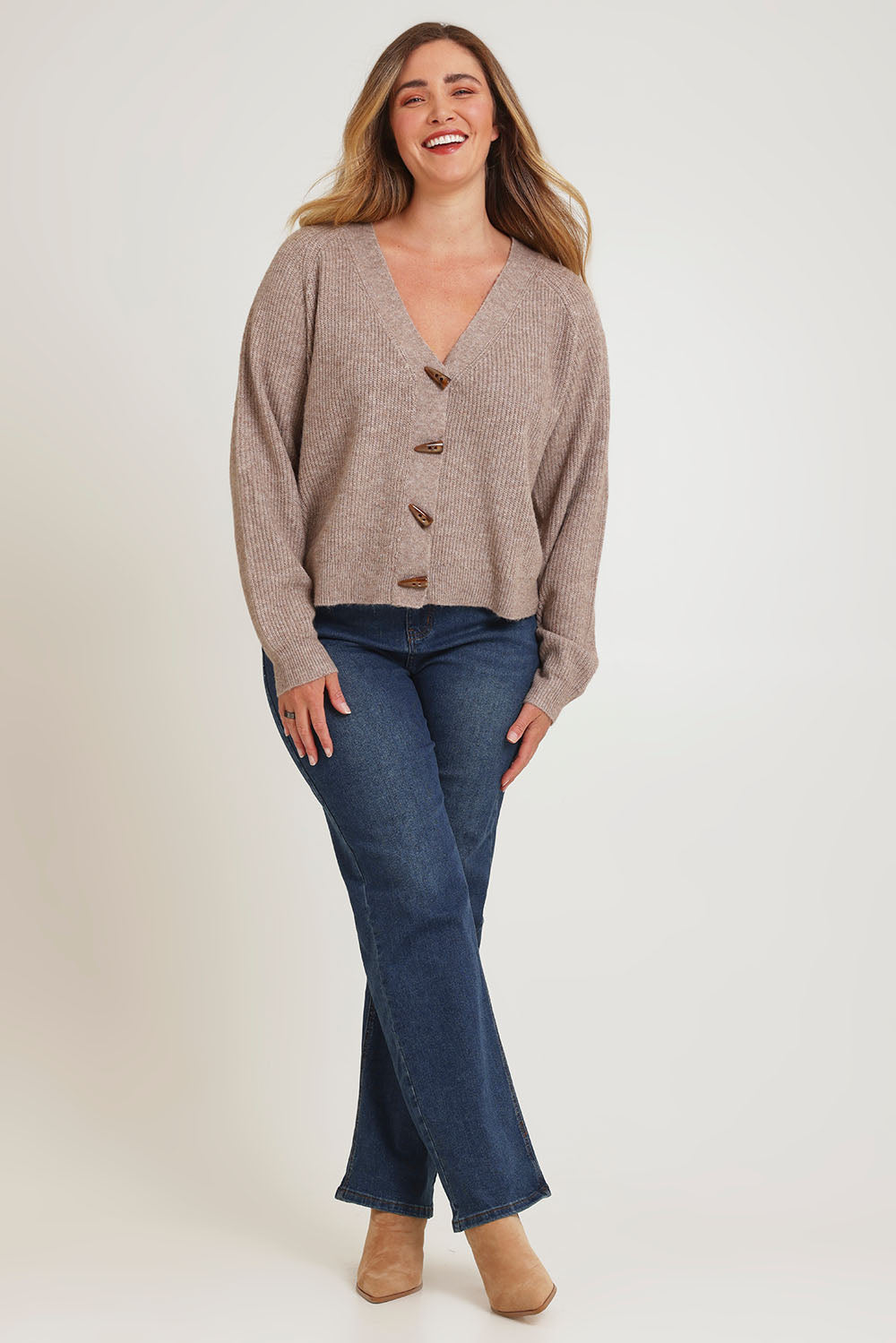 Model Chanel wearing size XL of the Found My Friend Recycled Knit Cardi in colour Earth, from the front, showing the whole outfit