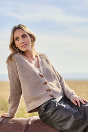 Model Tegan wearing size S of the Found My Friend Recycled Knit Cardi in colour Earth, from the front, showing the whole outfit