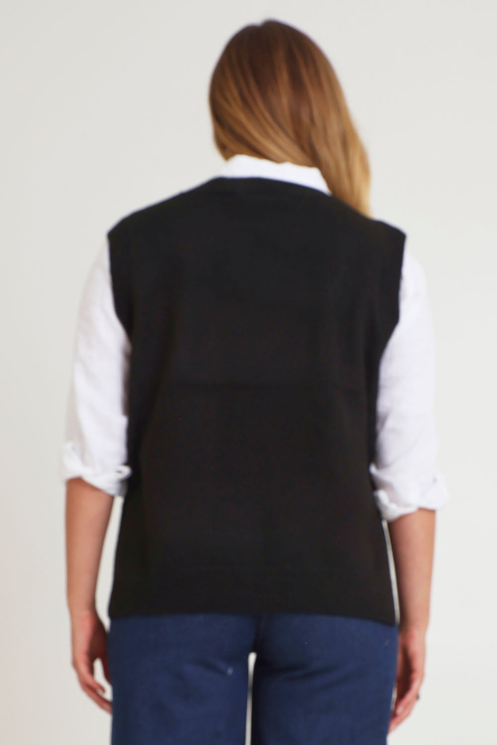 Model Chanel wearing size XL of the Found My Friend Recycled Knit Vest in colour Black (Black), from the back