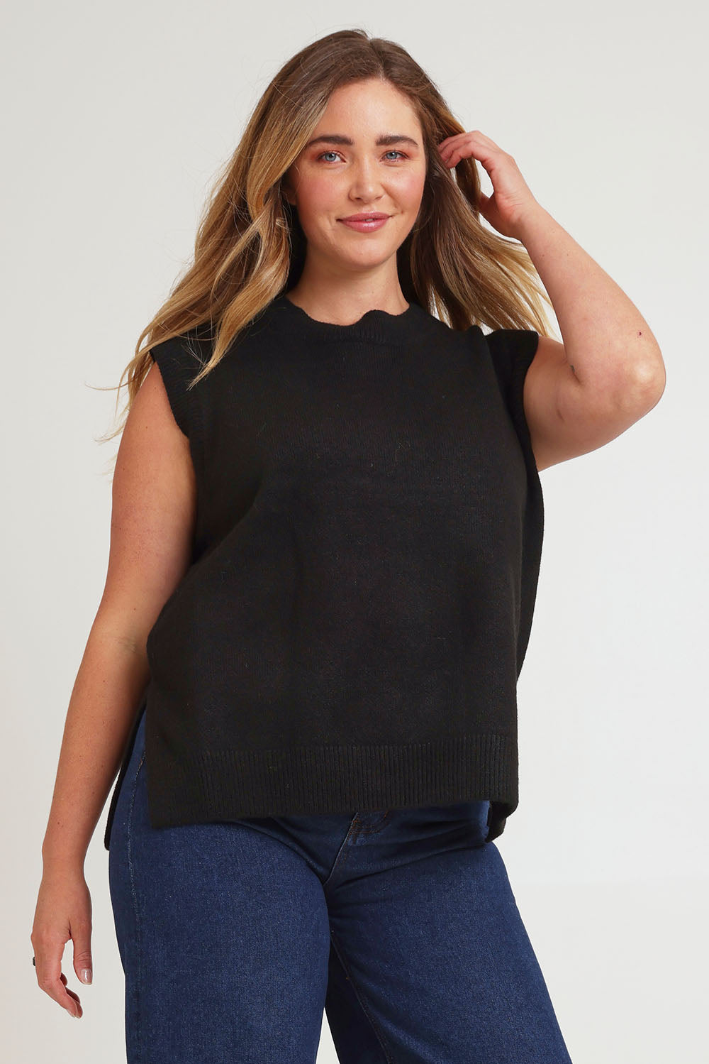 Model Chanel wearing size XL of the Found My Friend Recycled Knit Vest in colour Black (Black), from the front, cropped image