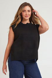 Model Chanel wearing size XL of the Found My Friend Recycled Knit Vest in colour Black (Black), from the front, cropped image