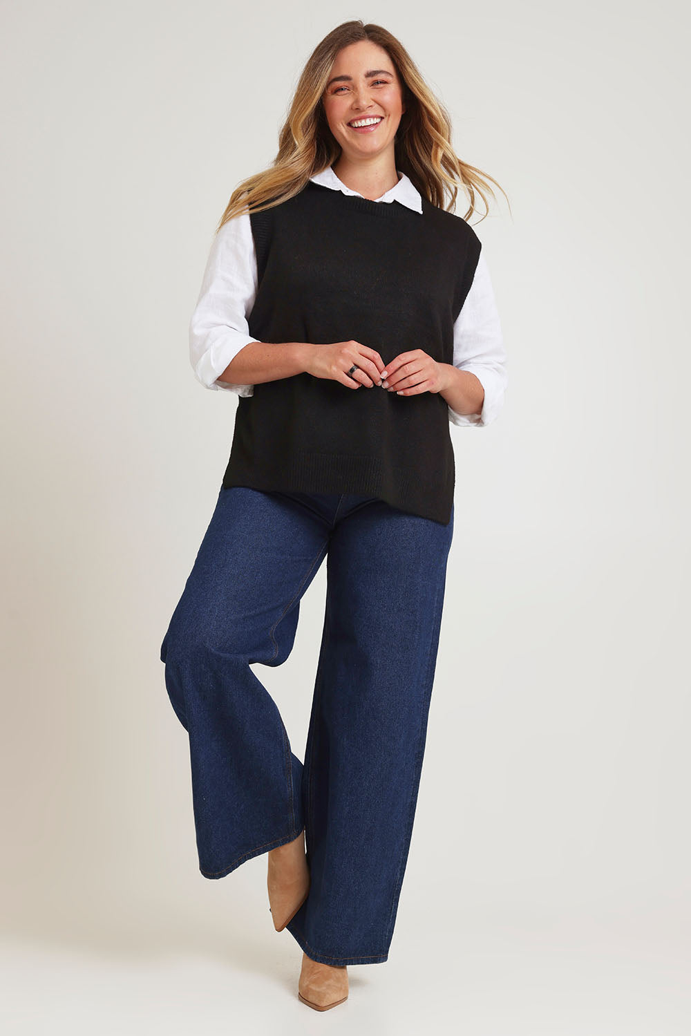 Model Chanel wearing size XL of the Found My Friend Recycled Knit Vest in colour Black (Black), from the front, showing the whole outfit