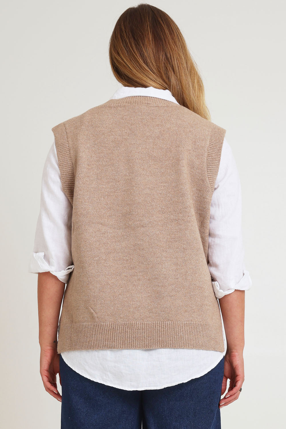 Model Chanel wearing size XL of the Found My Friend Recycled Knit Vest in colour Fawn, from the back