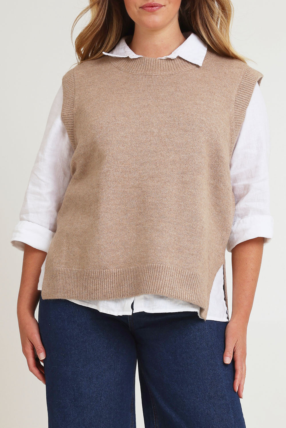 Model Chanel wearing size XL of the Found My Friend Recycled Knit Vest in colour Fawn, from the front, cropped image