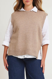 Model Chanel wearing size XL of the Found My Friend Recycled Knit Vest in colour Fawn, from the front, cropped image