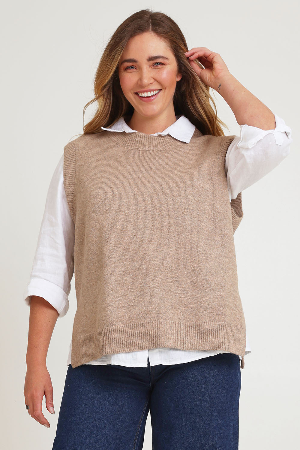 Model Chanel wearing size XL of the Found My Friend Recycled Knit Vest in colour Fawn, from the front, cropped image