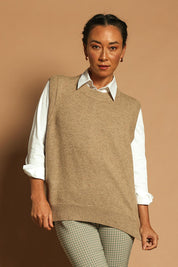 Model Katie wearing size S of the Found My Friend Recycled Knit Vest in colour Fawn, from the front, showing the whole outfit