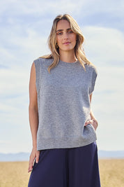 Model Kelly wearing size S of the Found My Friend Recycled Knit Vest in colour Greymarle (Grey), from the front, showing the whole outfit