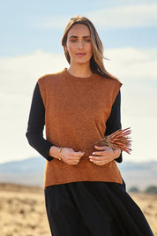 Model Tegan wearing size S of the Found My Friend Recycled Knit Vest in colour Ochre, from the front, showing the whole outfit