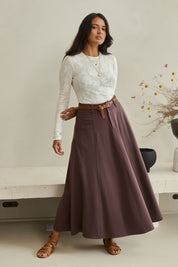 Model Tahnee wearing size 10 of the Sparking Joy Ponte Panelled Maxi Skirt in colour Chocolate, from the front, showing the whole outfit