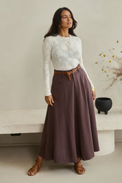 Model Tahnee wearing size 10 of the Sparking Joy Ponte Panelled Maxi Skirt in colour Chocolate, from the front, showing the whole outfit