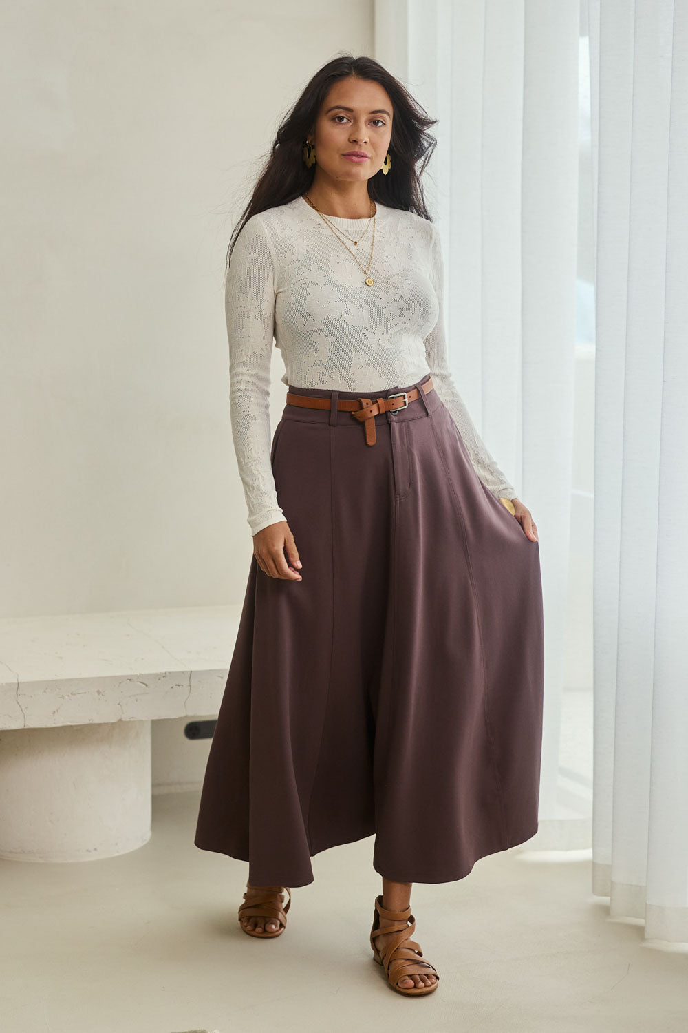 Model Tahnee wearing size 10 of the Sparking Joy Ponte Panelled Maxi Skirt in colour Chocolate, from the front, showing the whole outfit