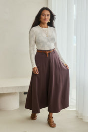 Model Tahnee wearing size 10 of the Sparking Joy Ponte Panelled Maxi Skirt in colour Chocolate, from the front, showing the whole outfit