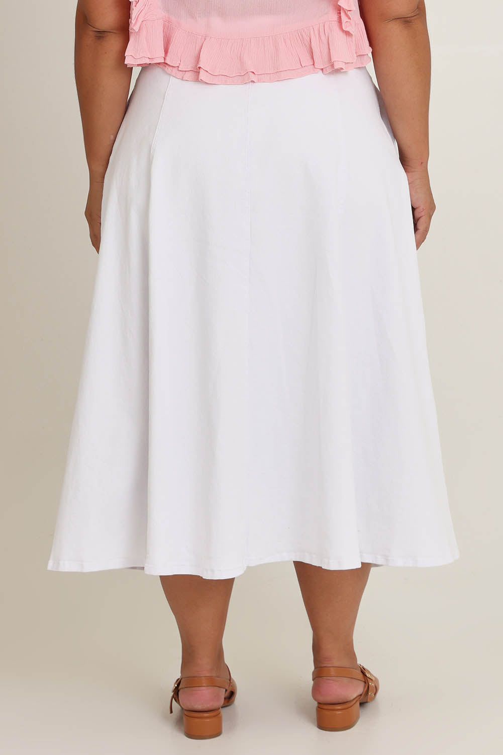Model Ashleigh wearing size 16 of the Sparking Joy Denim Panelled Skirt in colour White (White), from the back
