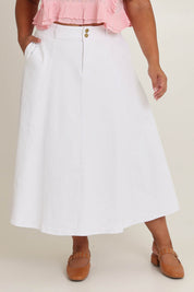 Model Ashleigh wearing size 16 of the Sparking Joy Denim Panelled Skirt in colour White (White), from the front, cropped image