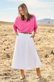 Model Tegan wearing size 10 of the Sparking Joy Denim Panelled Skirt in colour White (White), from the front, showing the whole outfit