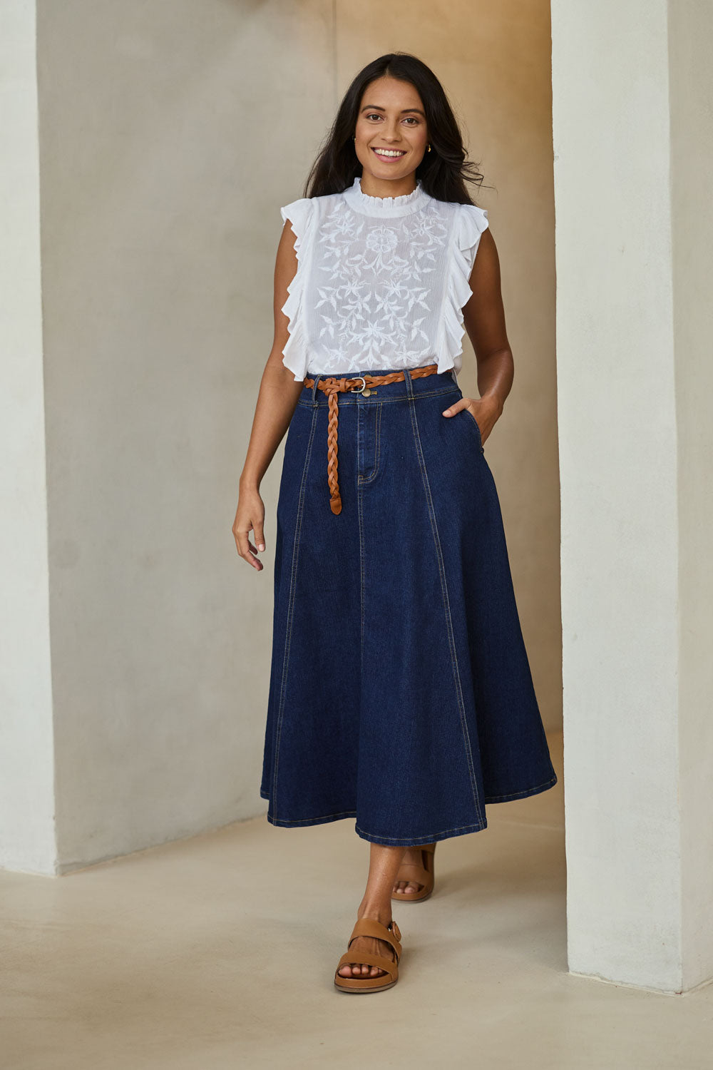 Model Tahnee wearing size 10 of the Sparking Joy Denim Panelled Skirt in colour Denim (Blue), from the front, showing the whole outfit