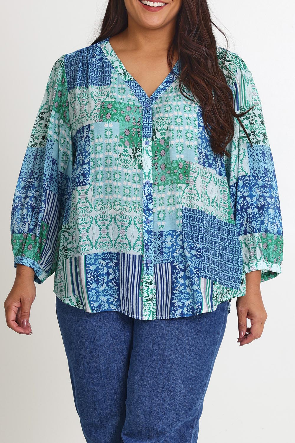 Model Ashleigh wearing size 16 of the Easy On Me Blouse in colour Green (Green), from the front, cropped image