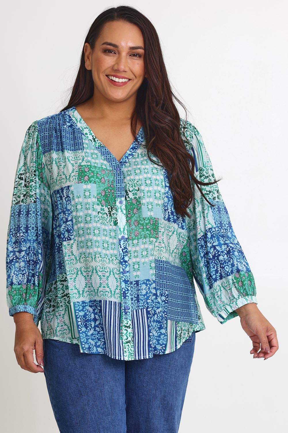 Model Ashleigh wearing size 16 of the Easy On Me Blouse in colour Green (Green), from the front, cropped image