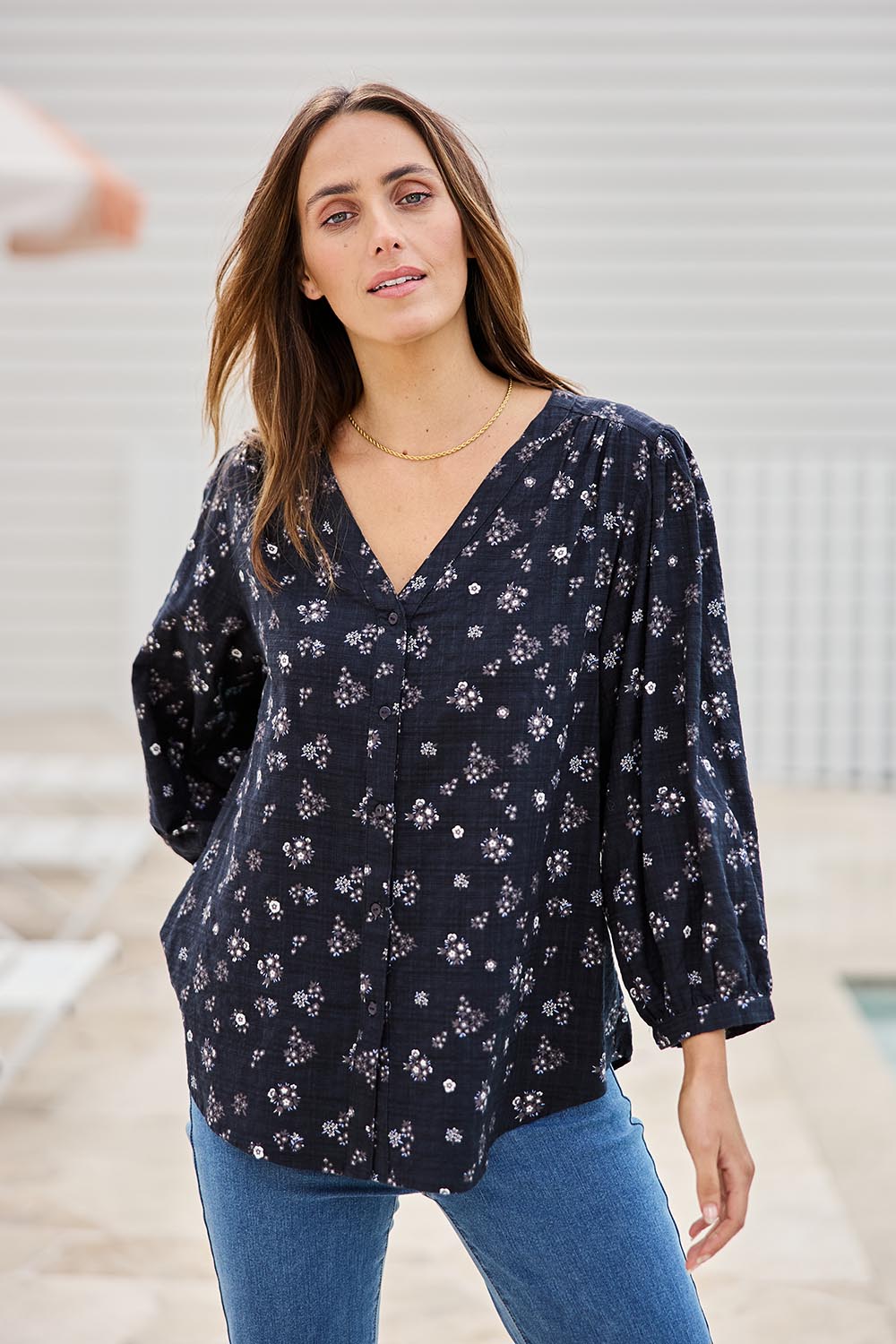 Model Tegand wearing size 10 of the Easy On Me Blouse – Navyfleur in colour Navyfleur, in a cropped view