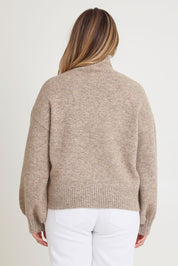 Model Chanel wearing size XL of the Lovely Day Billow Sleeve Wool Blend Jumper in colour Natural, from the back