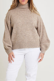 Model Chanel wearing size XL of the Lovely Day Billow Sleeve Wool Blend Jumper in colour Natural, from the front, cropped image