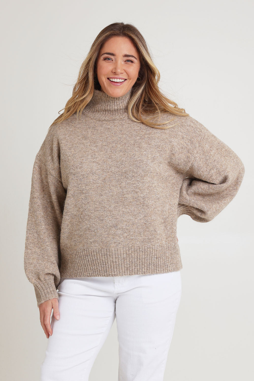 Model Chanel wearing size XL of the Lovely Day Billow Sleeve Wool Blend Jumper in colour Natural, from the front, cropped image