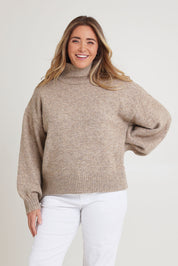 Model Chanel wearing size XL of the Lovely Day Billow Sleeve Wool Blend Jumper in colour Natural, from the front, cropped image