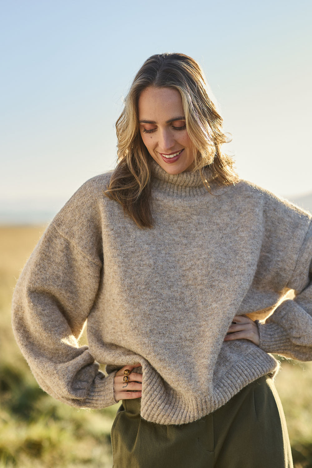 Model Tegan wearing size S of the Lovely Day Billow Sleeve Wool Blend Jumper in colour Natural, from the front, showing the whole outfit