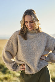 Model Tegan wearing size S of the Lovely Day Billow Sleeve Wool Blend Jumper in colour Natural, from the front, showing the whole outfit