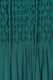 Product shot of the Meadow Meander Smocked Dress in colour Jade (Green), detail