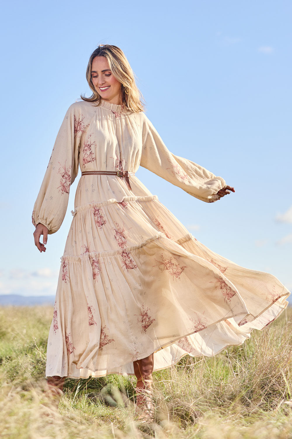 Model Tegan wearing size 10 of the Falling Into Your Arms Cotton Maxi Dress in colour Sandfleur, from the front, showing the whole outfit
