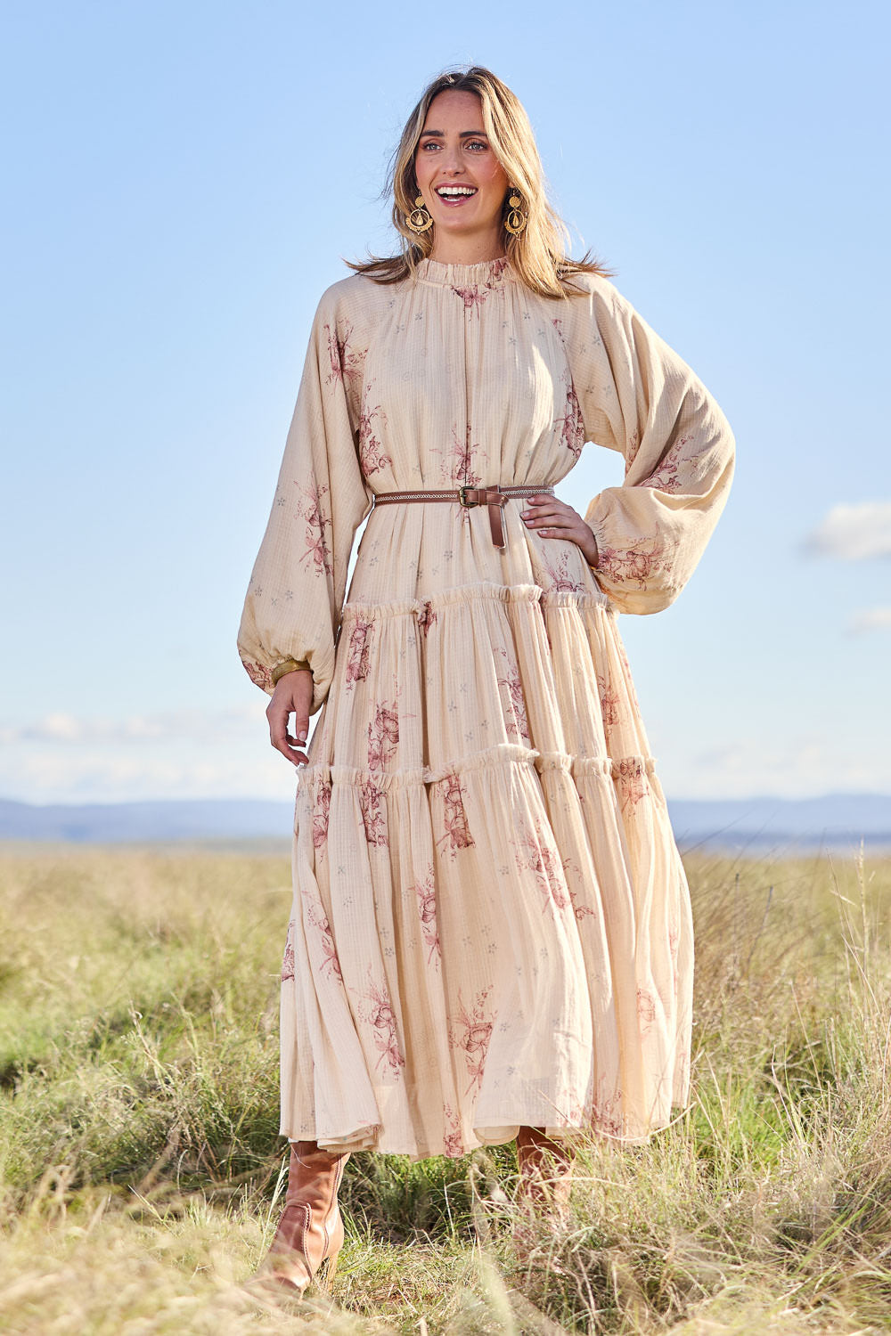 Model Tegan wearing size 10 of the Falling Into Your Arms Cotton Maxi Dress in colour Sandfleur, from the front, showing the whole outfit