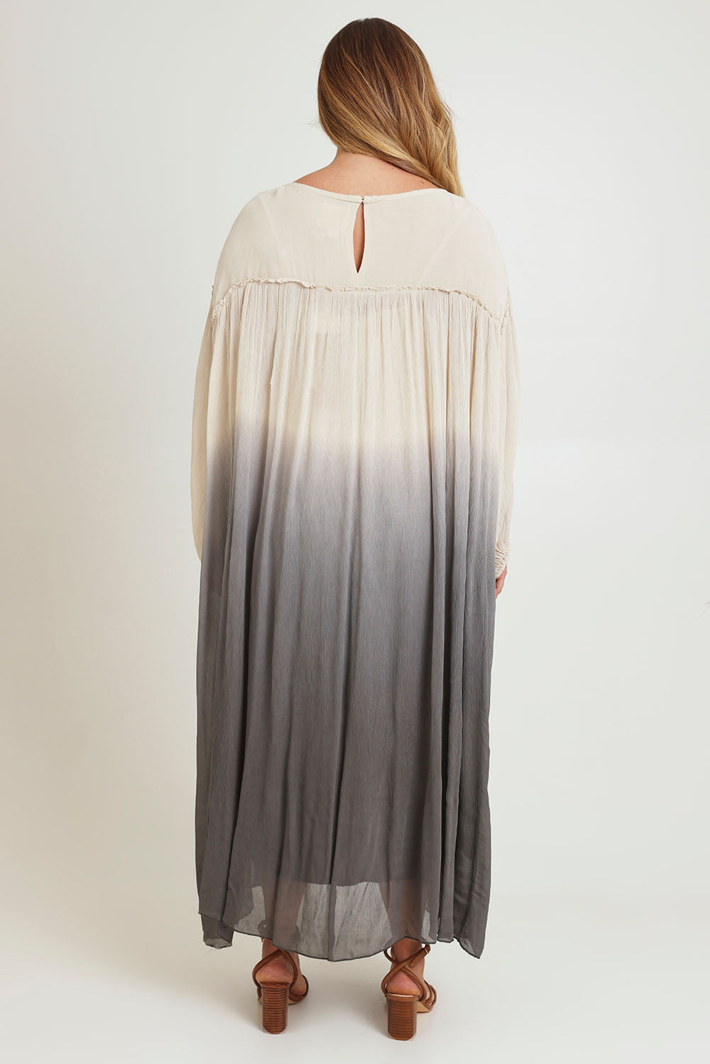 Model Chanel wearing size 16 of the First Love Gathered Ombre Dress in colour Earthombre, from the back