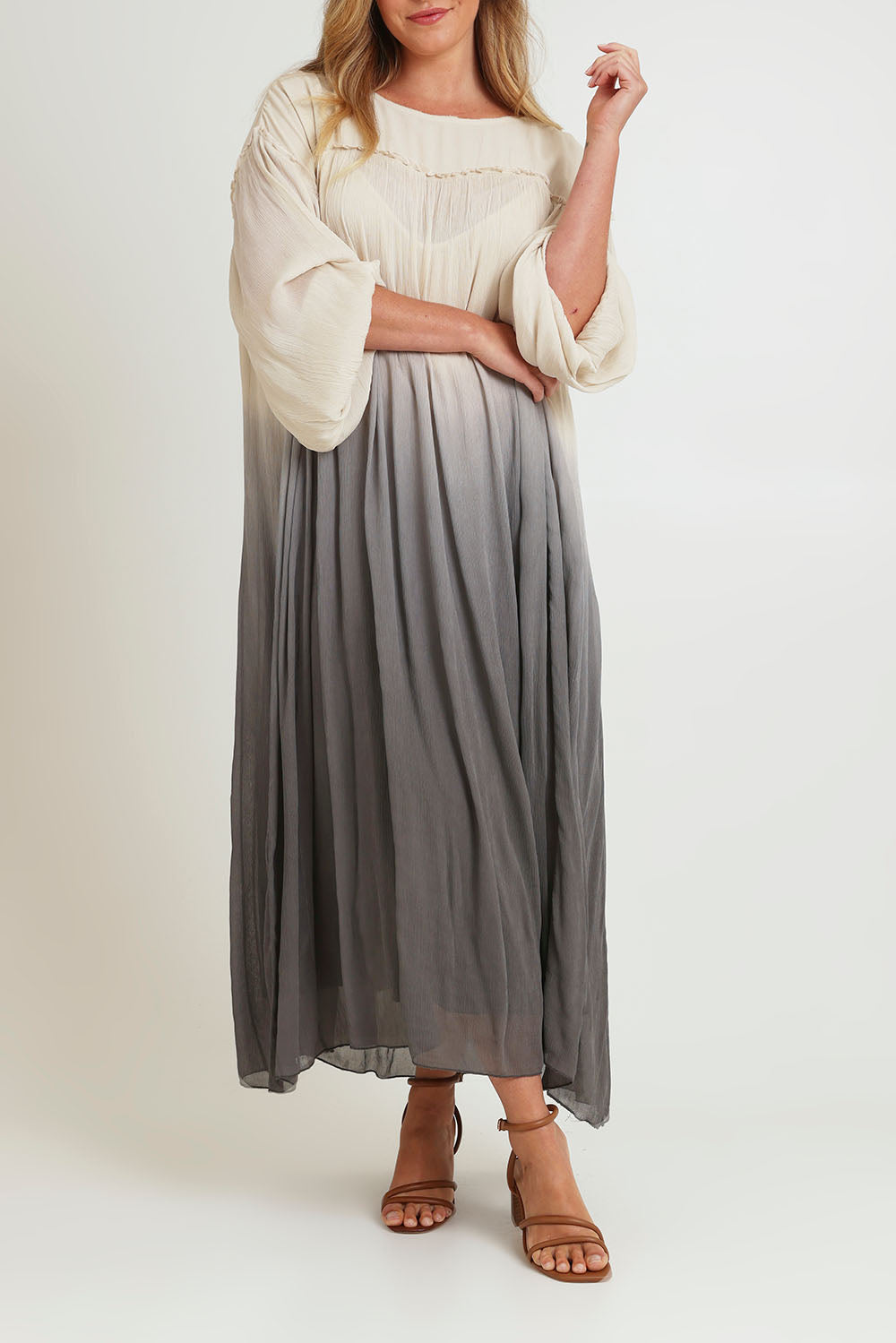 Model Chanel wearing size 16 of the First Love Gathered Ombre Dress in colour Earthombre, from the front, cropped image