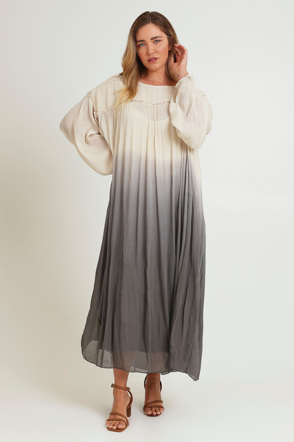 Model Chanel wearing size 16 of the First Love Gathered Ombre Dress in colour Earthombre, from the front, showing the whole outfit
