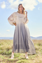 Model Tegan wearing size 10 of the First Love Gathered Ombre Dress in colour Earthombre, from the front, showing the whole outfit