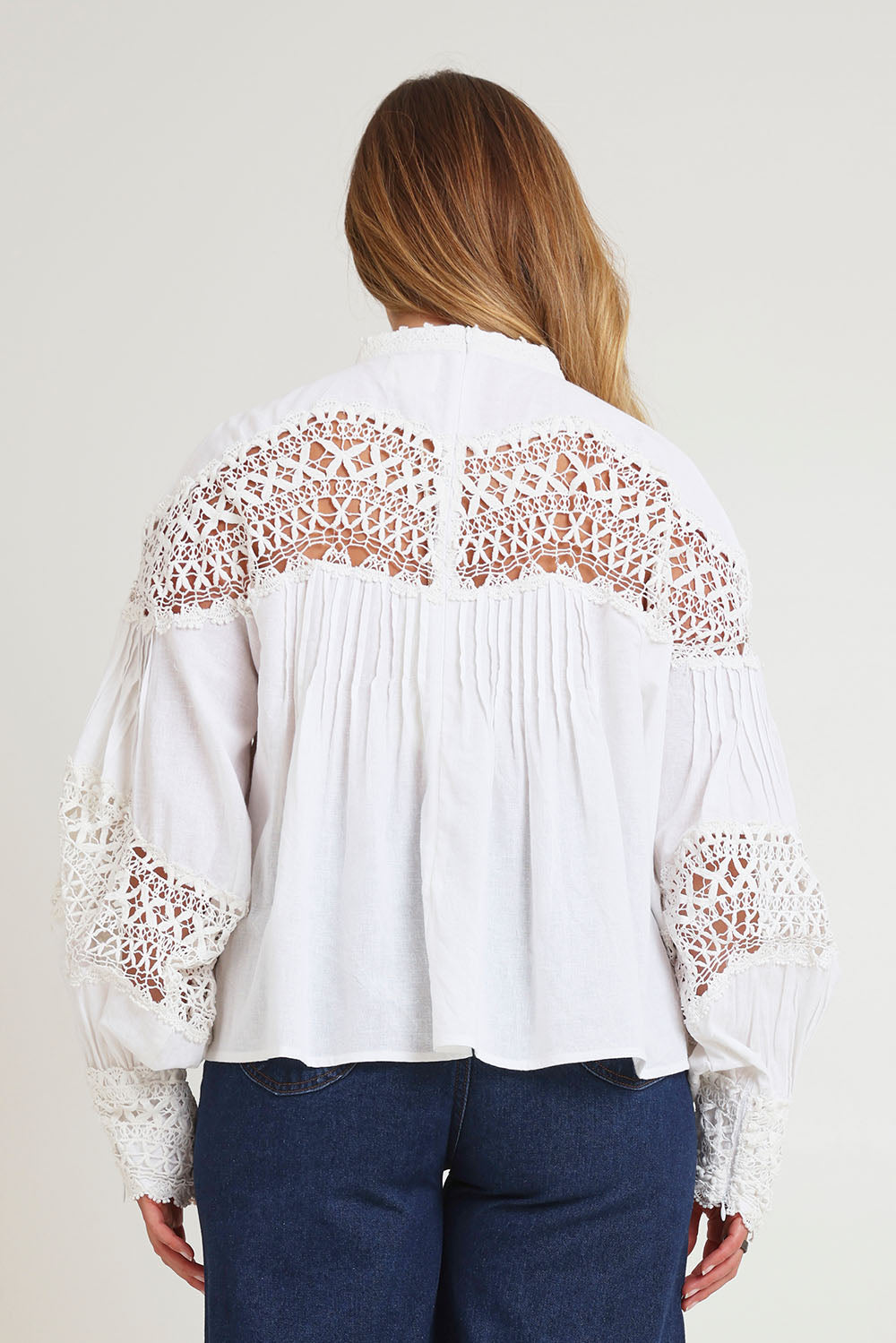 Model Chanel wearing size 16 of the High Tea With Me Cotton Blouse in colour White (White), from the back