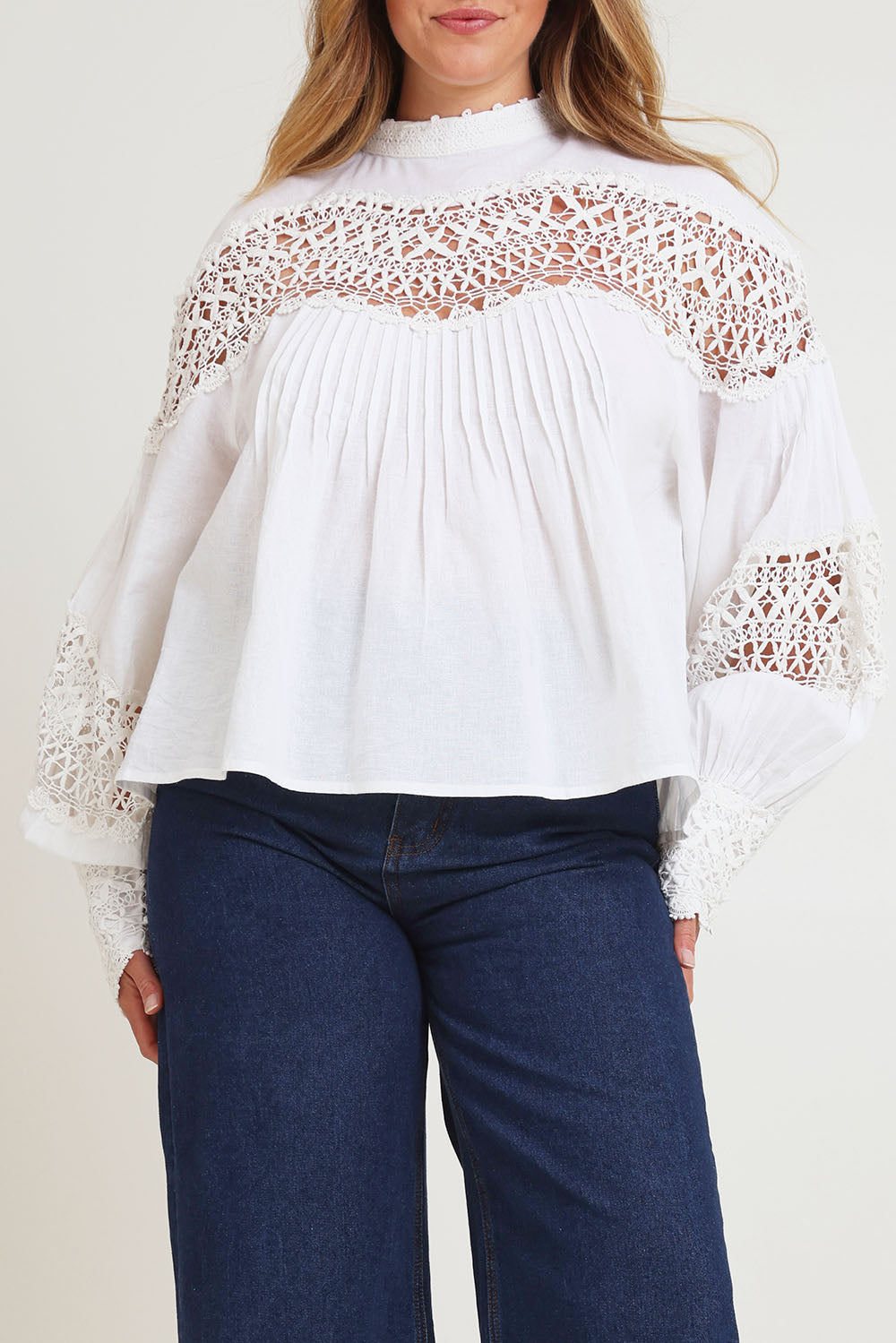 Model Chanel wearing size 16 of the High Tea With Me Cotton Blouse in colour White (White), from the front, cropped image