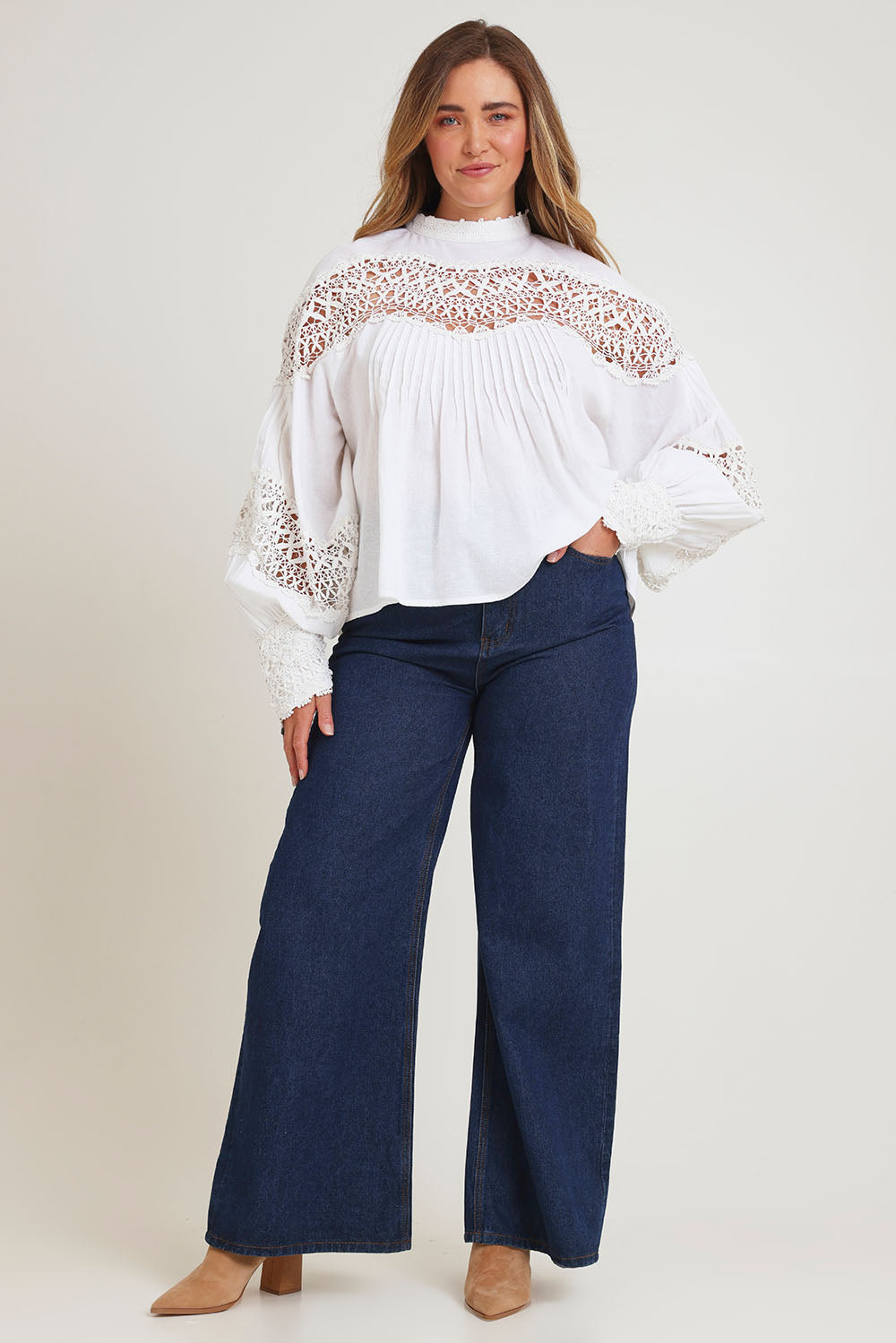 Model Chanel wearing size 16 of the High Tea With Me Cotton Blouse in colour White (White), from the front, showing the whole outfit