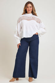 Model Chanel wearing size 16 of the High Tea With Me Cotton Blouse in colour White (White), from the front, showing the whole outfit