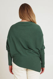 Model Chanel wearing size XL of the Snuggle Up True Knit Jumper in colour Pine (Green), from the back