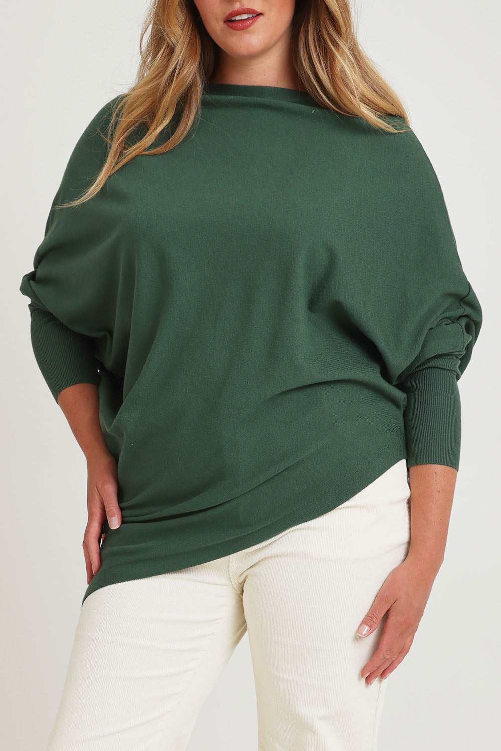 Model Chanel wearing size XL of the Snuggle Up True Knit Jumper in colour Pine (Green), from the front, cropped image