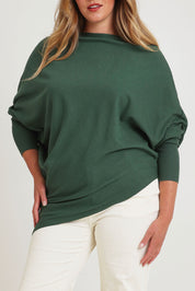 Model Chanel wearing size XL of the Snuggle Up True Knit Jumper in colour Pine (Green), from the front, cropped image