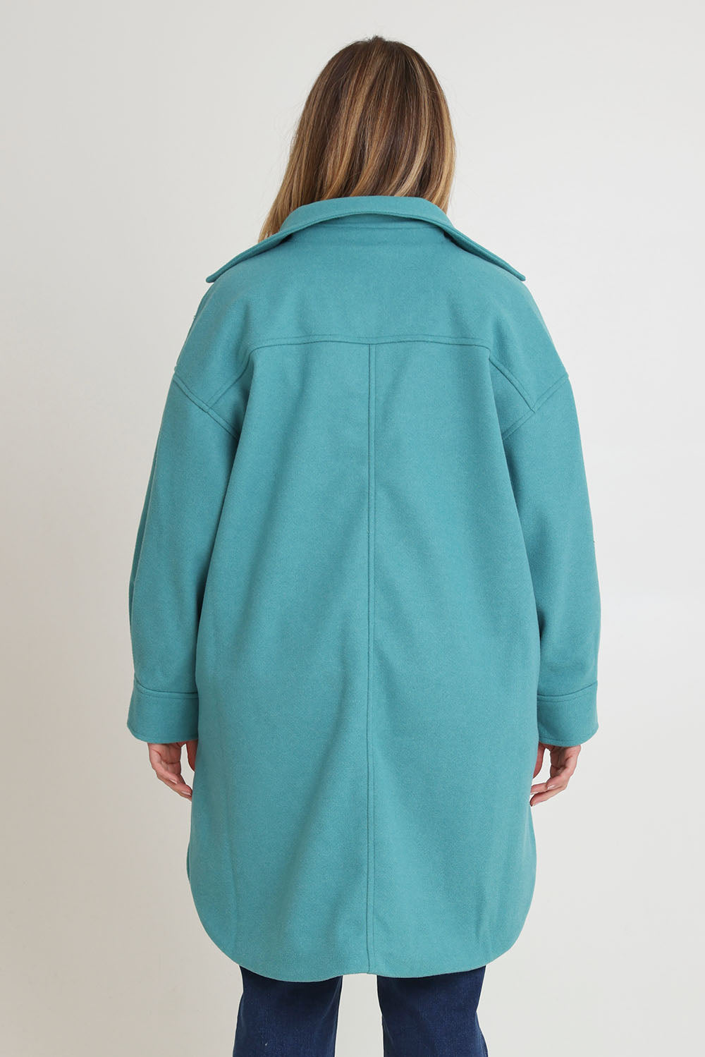 Model Chanel wearing size 16 of the Through The Trees Jacket in colour Teal (Blue), from the back