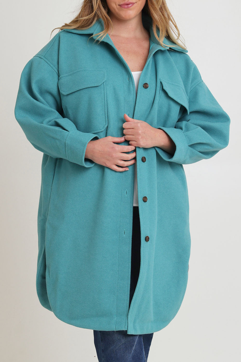 Model Chanel wearing size 16 of the Through The Trees Jacket in colour Teal (Blue), from the front, cropped image