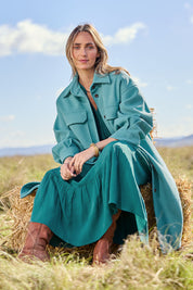 Model Tegan wearing size 10 of the Through The Trees Jacket in colour Teal (Blue), from the front, showing the whole outfit